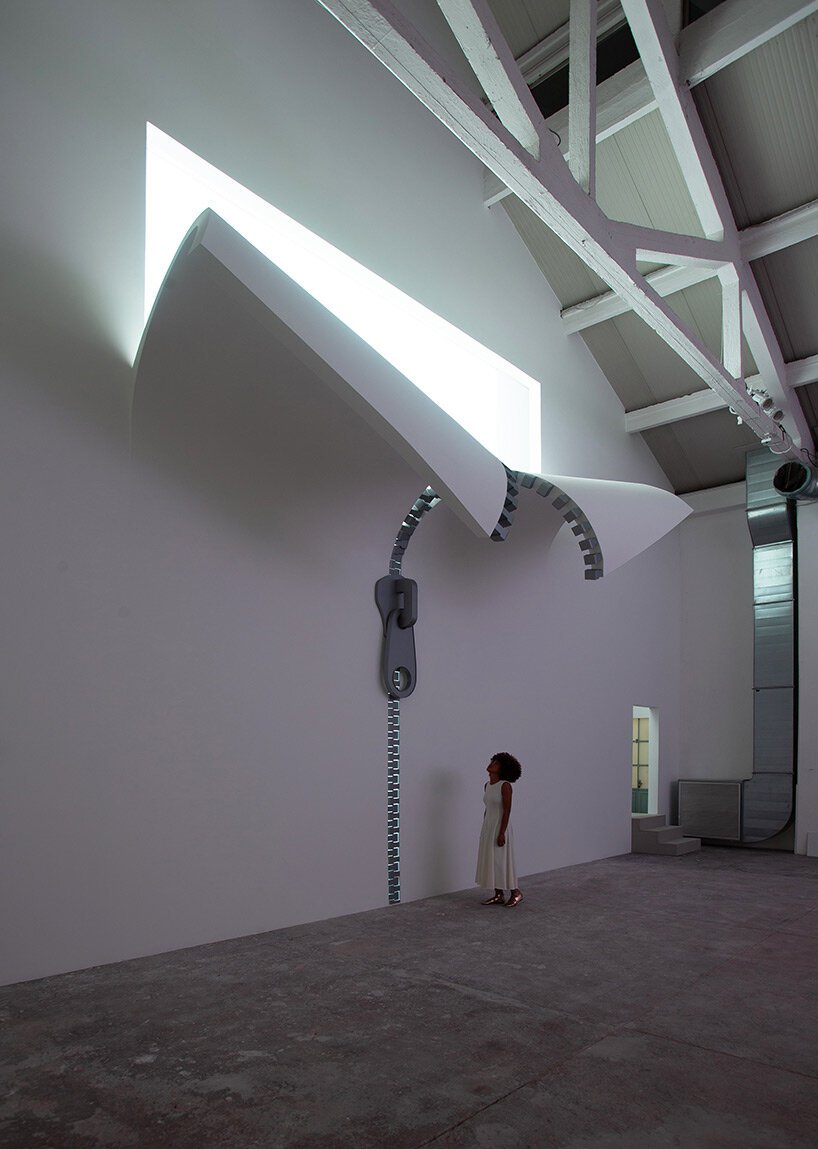 unzipping the ordinary: alex chinneck on bending reality through art, awe, and accessible experiences