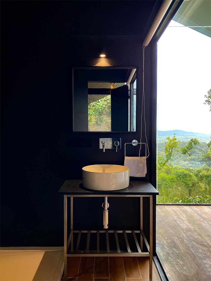 this prefabricated, 21sqm cabin features a panoramic glass façade to enjoy stunning views