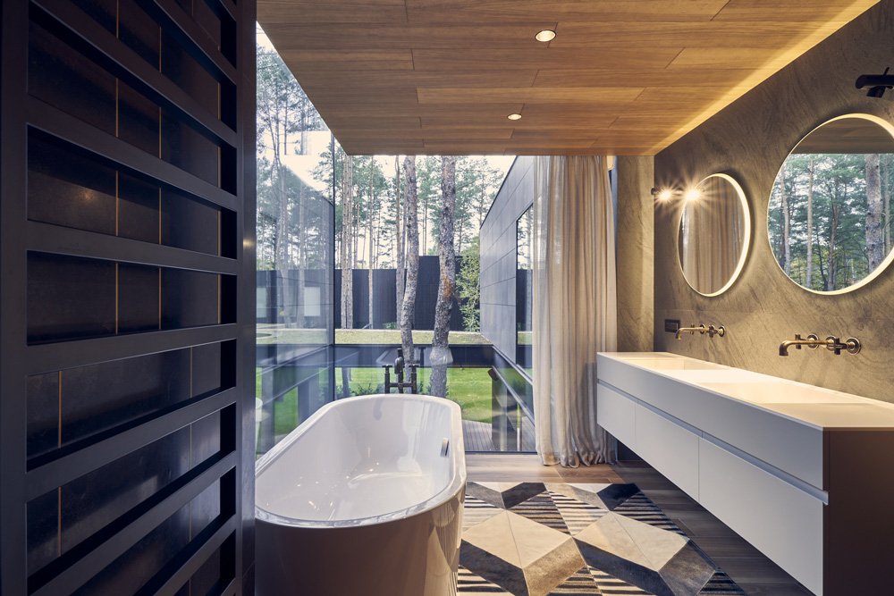 莫比乌斯建筑事务所设计的圆形木屋融入了波兰的松树林环境