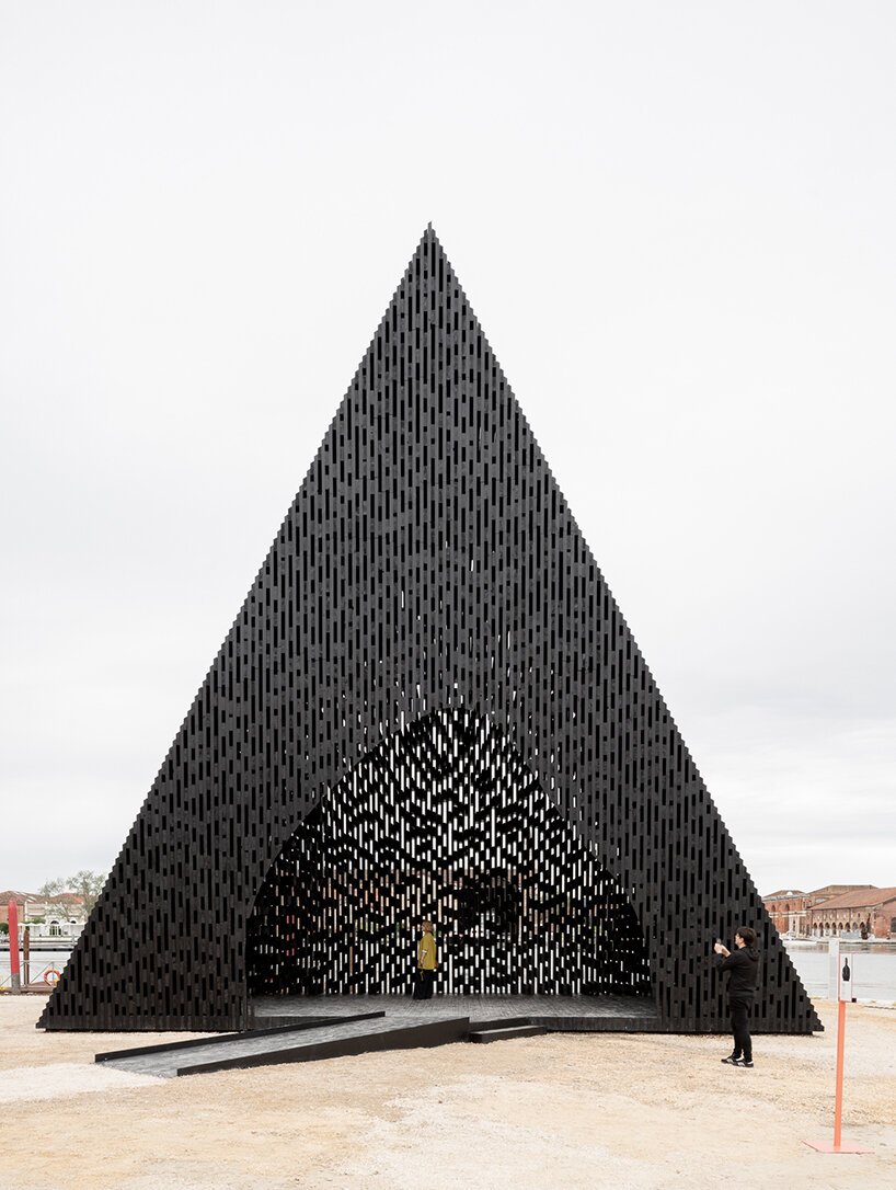 david adjaye shapes kwaeε pavilion as triangular timber prism at venice architecture biennale