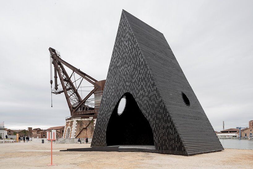david adjaye shapes kwaeε pavilion as triangular timber prism at venice architecture biennale
