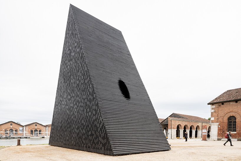 david adjaye shapes kwaeε pavilion as triangular timber prism at venice architecture biennale