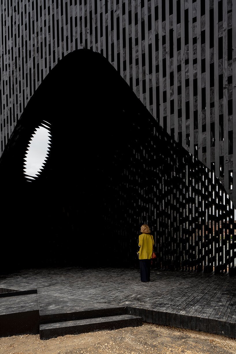 david adjaye shapes kwaeε pavilion as triangular timber prism at venice architecture biennale
