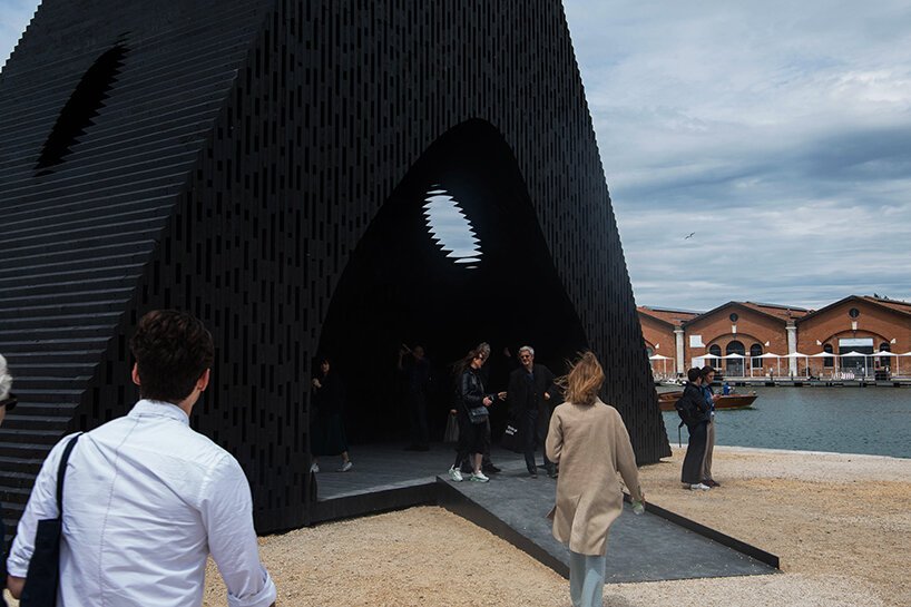 david adjaye shapes kwaeε pavilion as triangular timber prism at venice architecture biennale