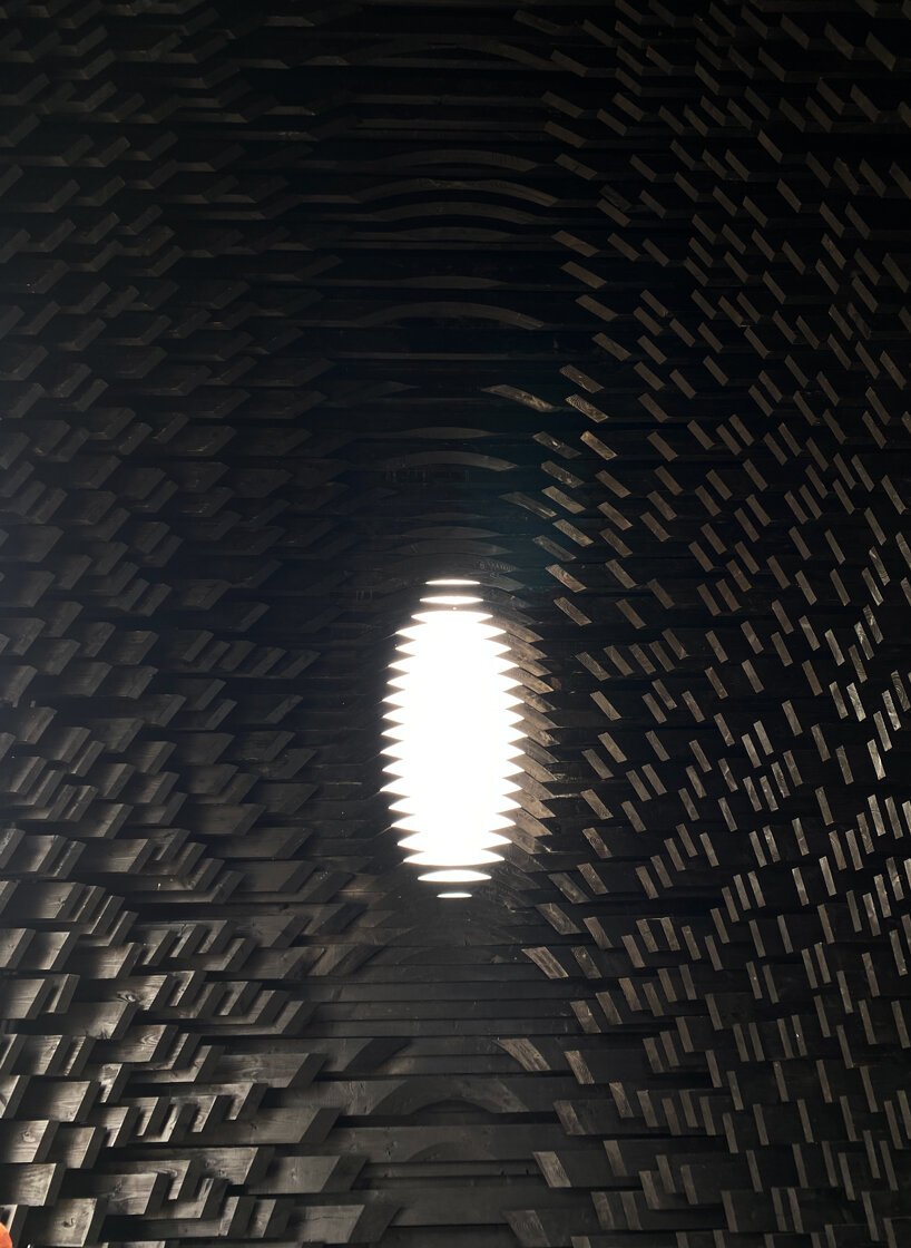 david adjaye shapes kwaeε pavilion as triangular timber prism at venice architecture biennale