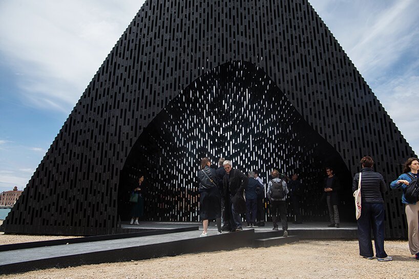 david adjaye shapes kwaeε pavilion as triangular timber prism at venice architecture biennale
