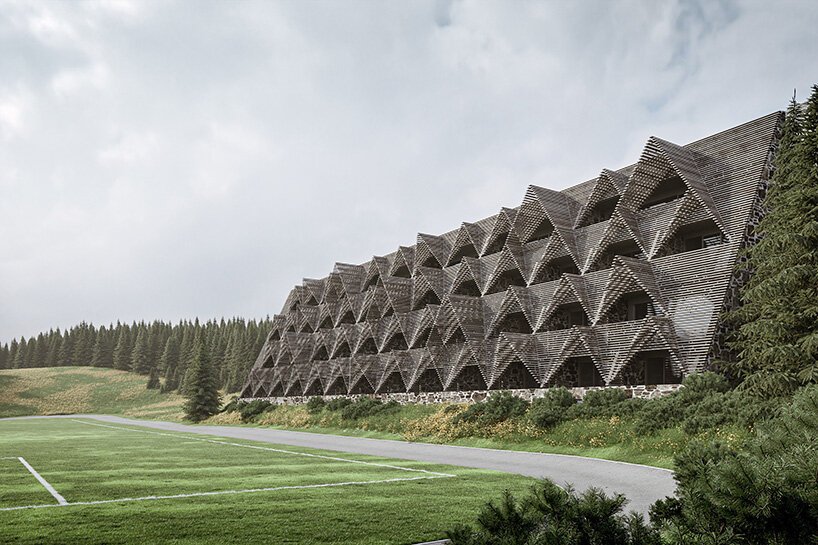 a stack of timber A-frames by enota architects to extend slovenia’s hotel natura