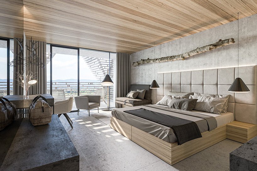 a stack of timber A-frames by enota architects to extend slovenia’s hotel natura