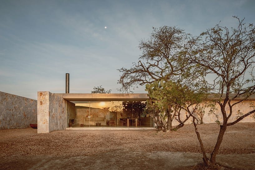 dispersed stone volumes and alleys develop a cruciform residential plan in mexico