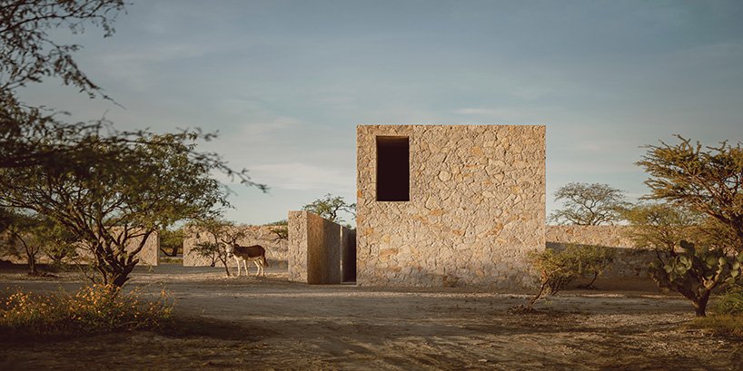 dispersed stone volumes and alleys develop a cruciform residential plan in mexico
