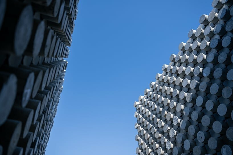 bamboo battens and discarded concrete spacers envelop art studio in thailand