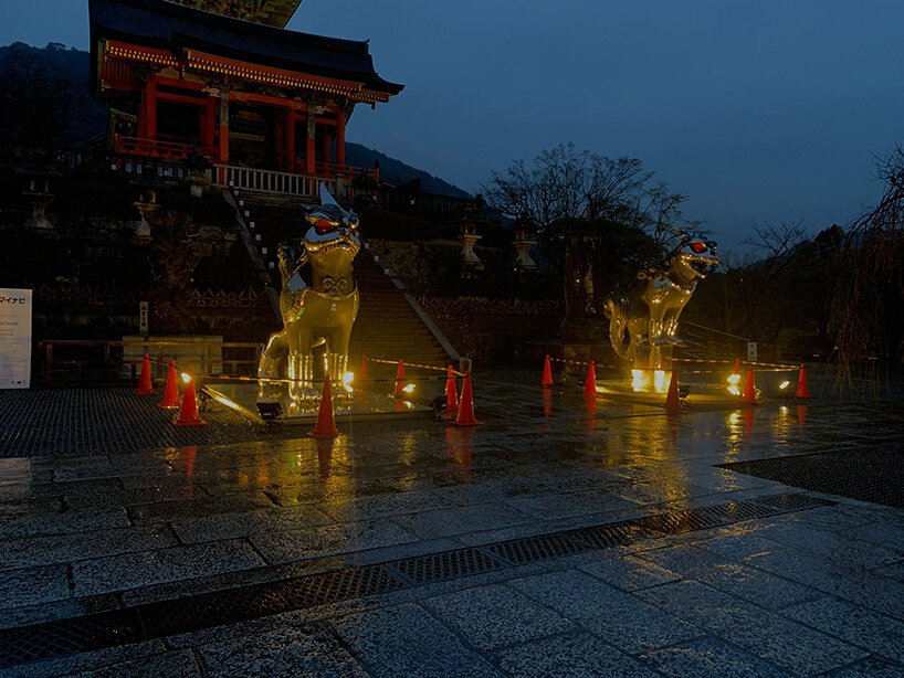giant kokeshi doll welcomes visitors to historic kiyomizu-dera temple in kyoto