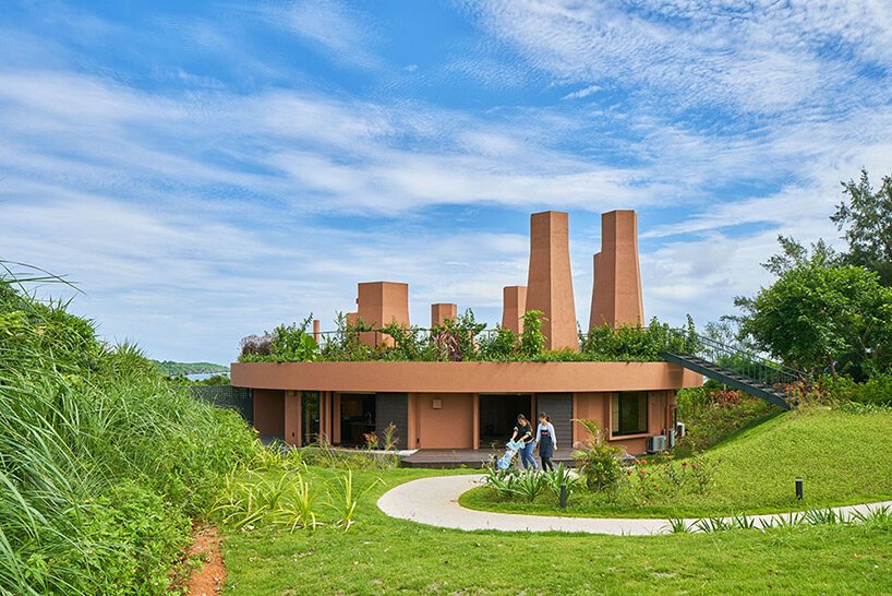 wind chimneys with glassless skylights illuminate care house by hiroshi nakamura & NAP in japan