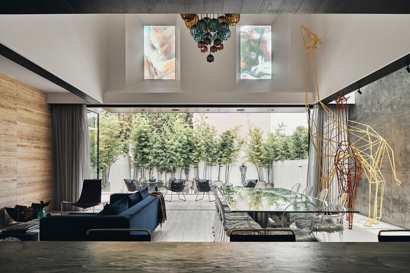 a translucent glass mural adorns the façade of JARtB house in melbourne