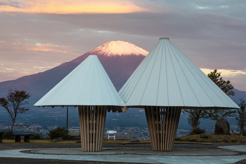 kengo kuma mirrors the iconic form of mount fuji with