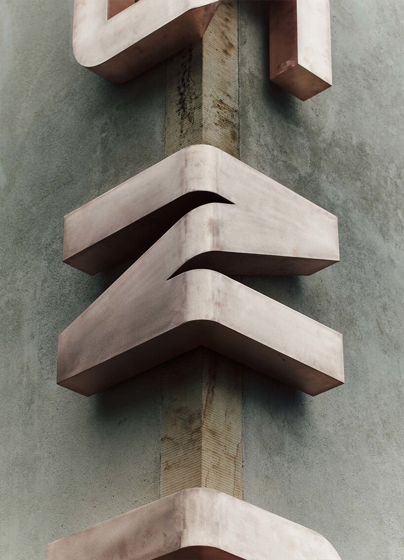 scaled bronze letters embrace the corner of kunsthalle praha building