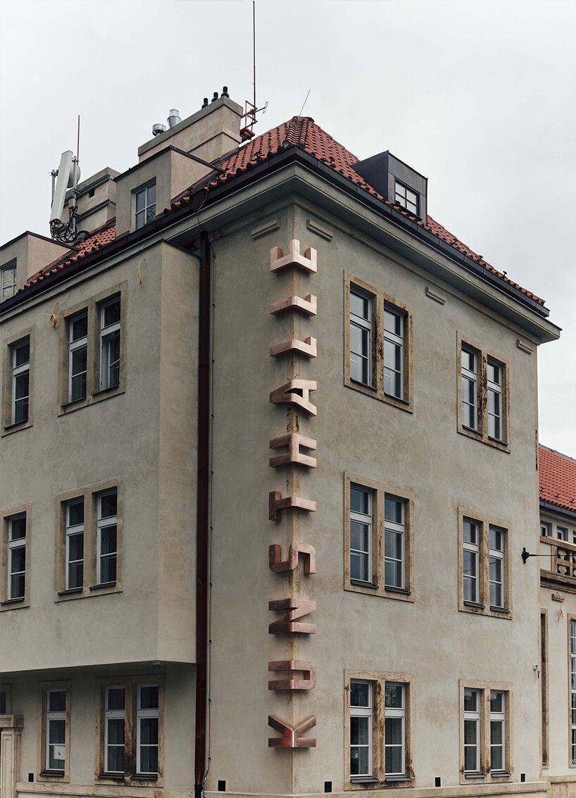 scaled bronze letters embrace the corner of kunsthalle praha building