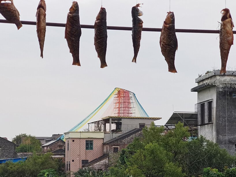 MAD architects wraps abandoned chinese landmark in ethereal veil of multicolored cloth