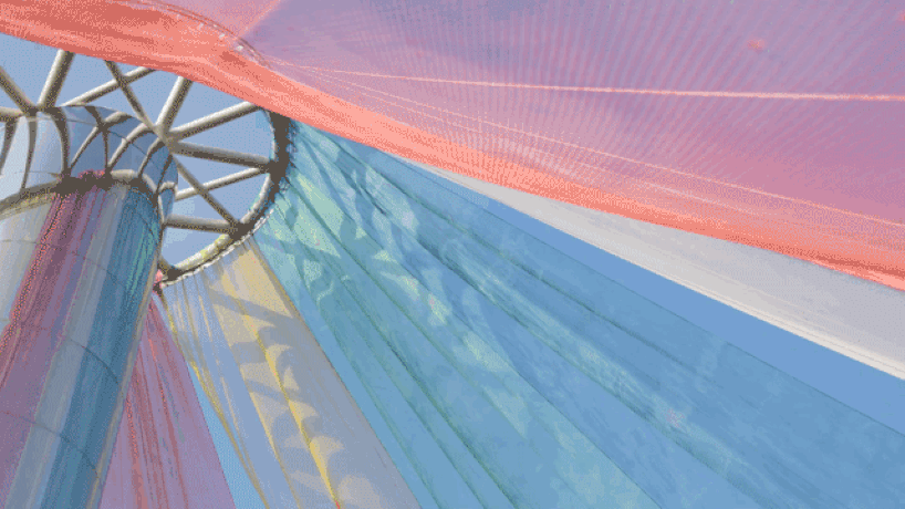 MAD architects wraps abandoned chinese landmark in ethereal veil of multicolored cloth