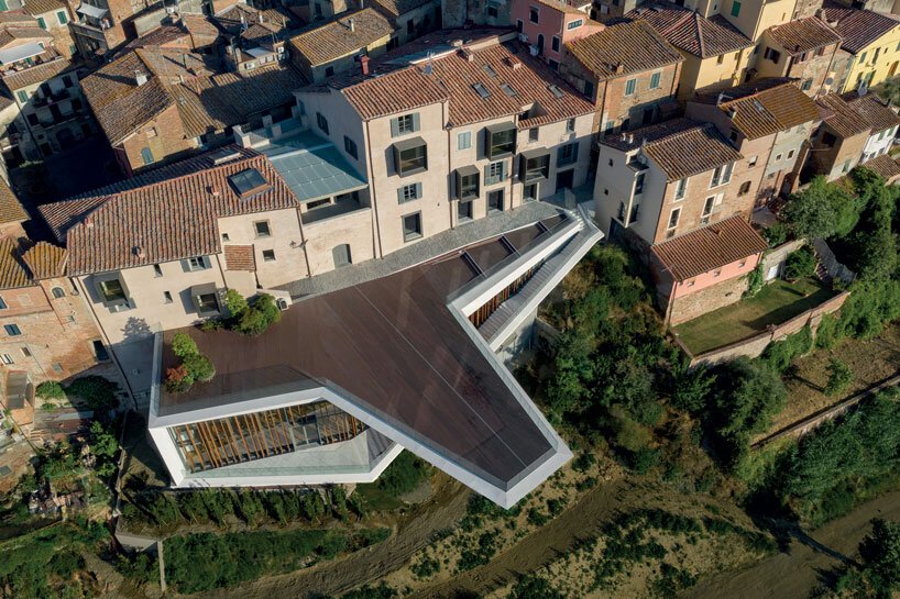 mario cucinella revives an italian hill town with cantilevered cultural center