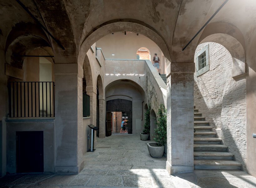 mario cucinella revives an italian hill town with cantilevered cultural center