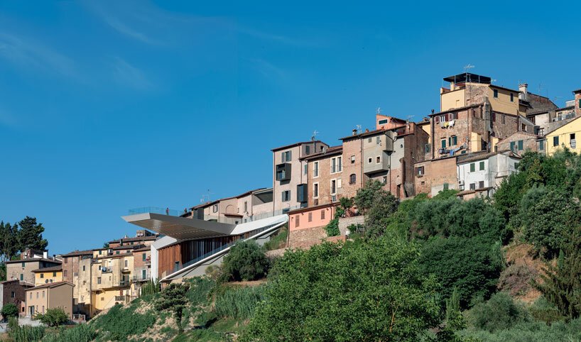mario cucinella revives an italian hill town with cantilevered cultural center