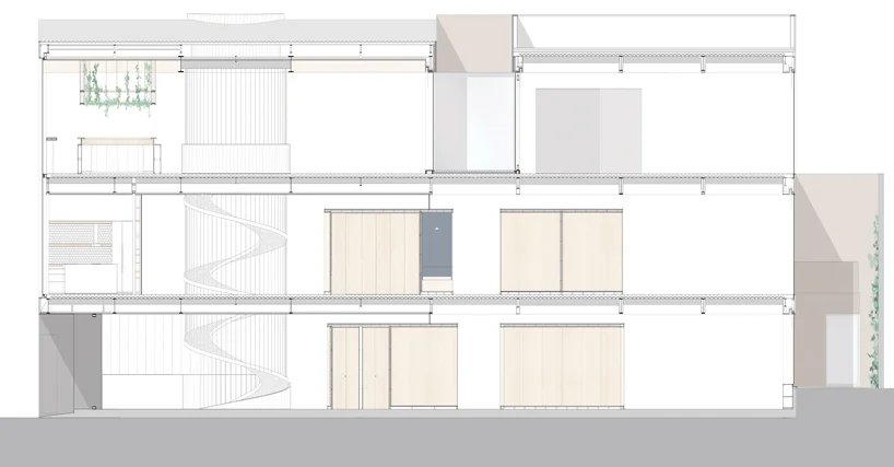 葡萄牙的雕塑螺旋楼梯连接着保罗·梅里尼 (Paulo Merlini) 的仓库改建的办公室