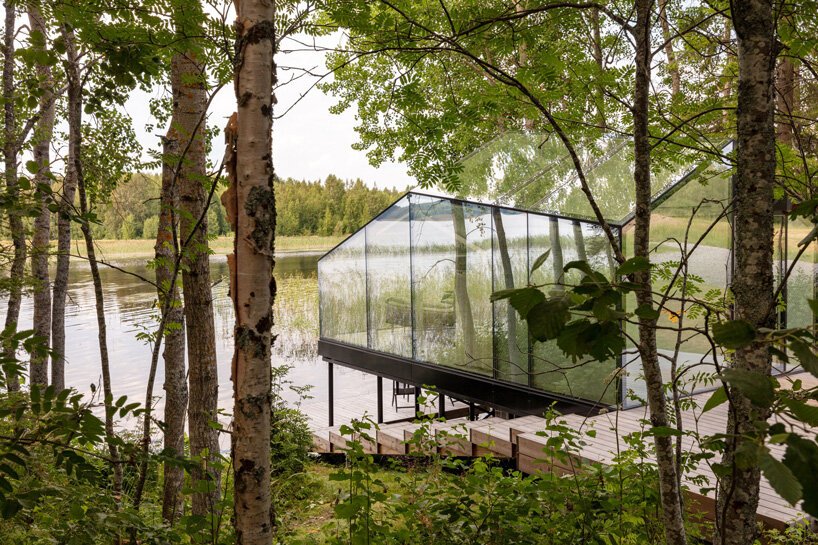 mirrored glass cabin by pirinen & salo disappears into finland