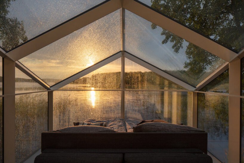 mirrored glass cabin with panoramic views disappears into finland’s rich natural landscape