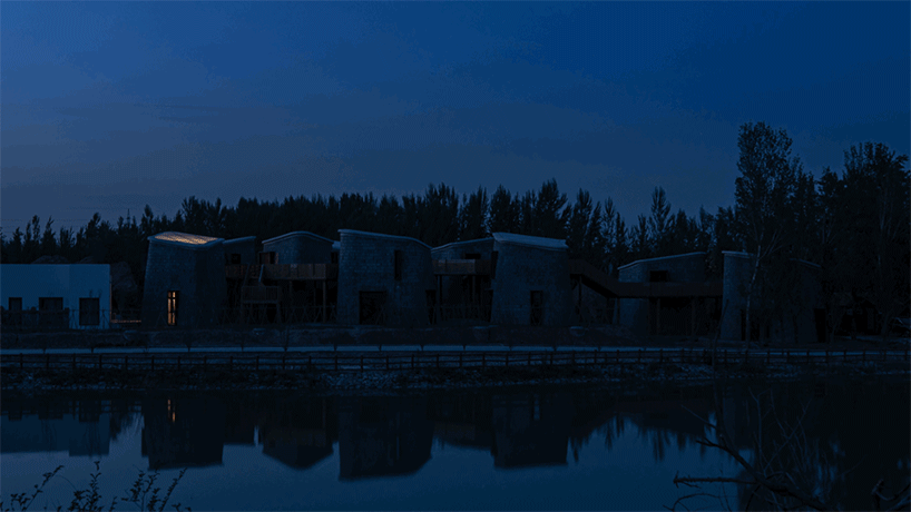 network of floating timber bridges unites scattered organic-shaped