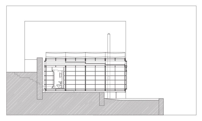 透过马丁·拉杰尼什设计的“河上工作室”的玻璃窗可以看到古老的石墙 透过马丁·拉杰尼什设计的“河上工作室”的玻璃窗可以看到古老的石墙