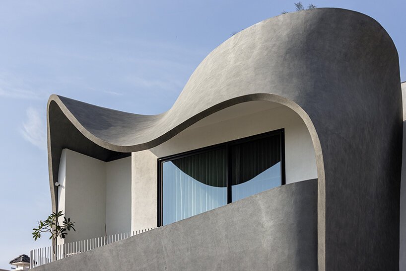 concrete ribbon wraps around studio ardete