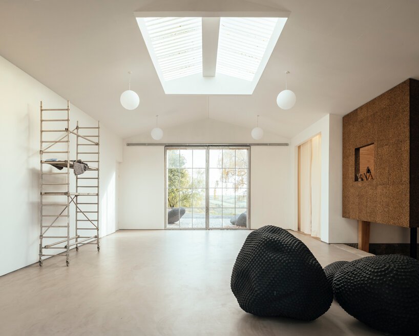 thomas randall-page turns an agricultural barn into a studio for his sculptor father in rural devon