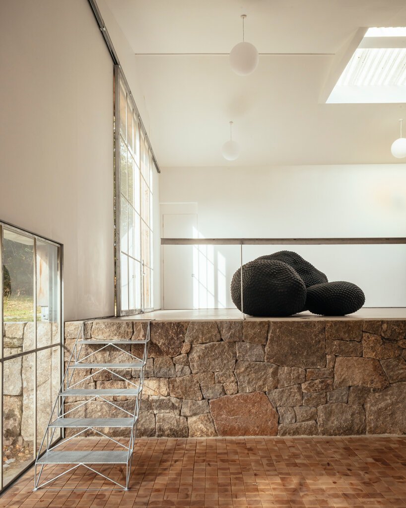 thomas randall-page turns an agricultural barn into a studio for his sculptor father in rural devon