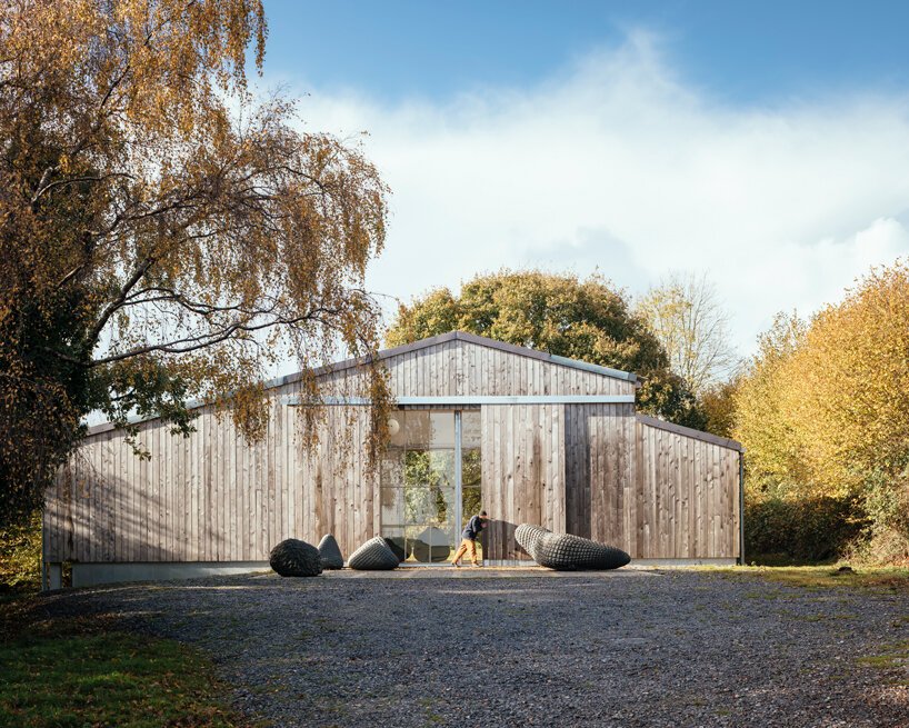 thomas randall-page turns an agricultural barn into a studio for his sculptor father in rural devon