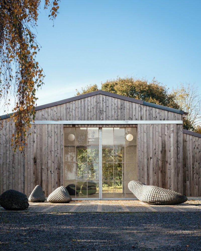 thomas randall-page turns an agricultural barn into a studio for his sculptor father in rural devon