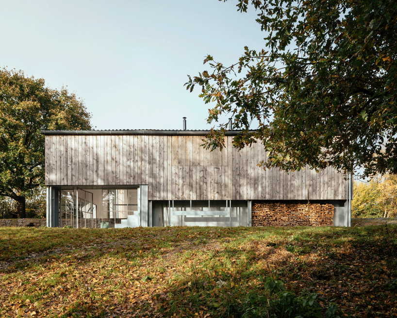 thomas randall-page turns an agricultural barn into a studio for his sculptor father in rural devon