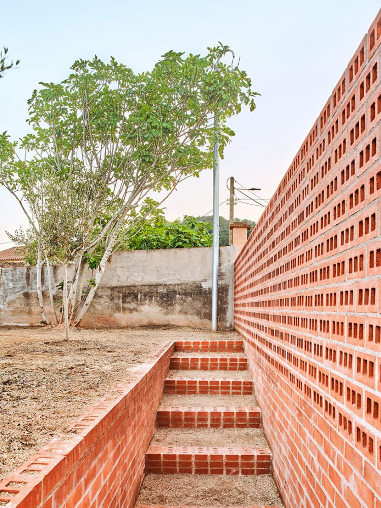 ágora arquitectura stacks cross laminated timber house atop old brick base in spain