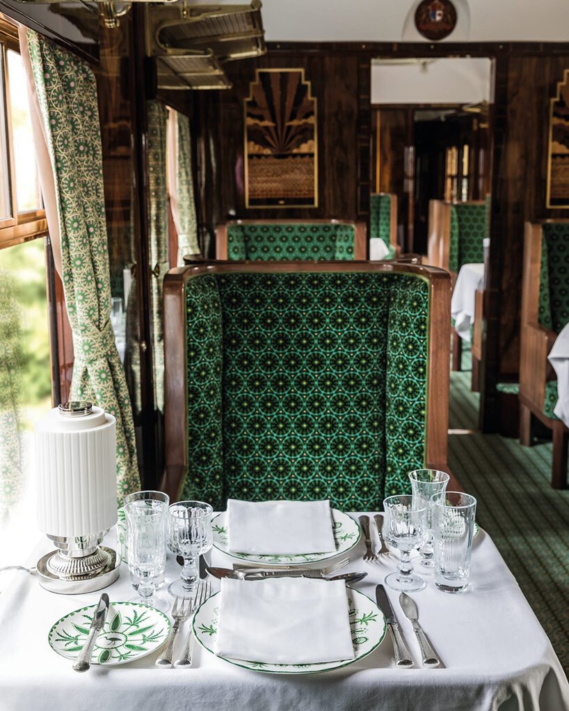 wes anderson revives 1950s train carriage inviting visitors into whimsical film sets